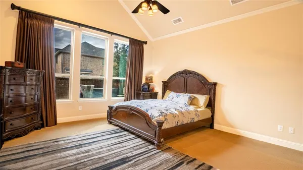 a bedroom with a bed and a mirror