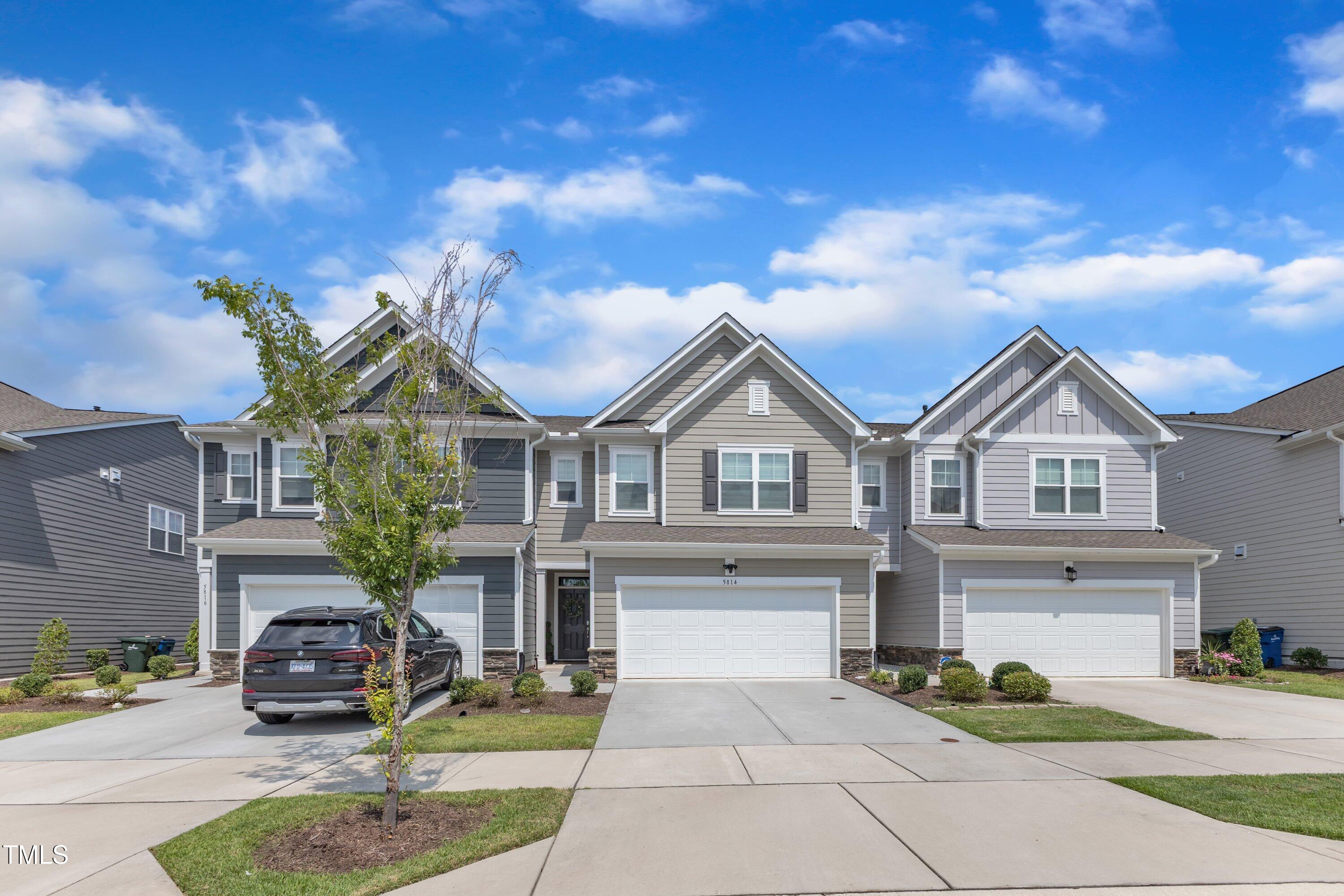 5814 Empathy Lane Raleigh, NC 27616 - Photo 1 of 48 a front view of a house with garden