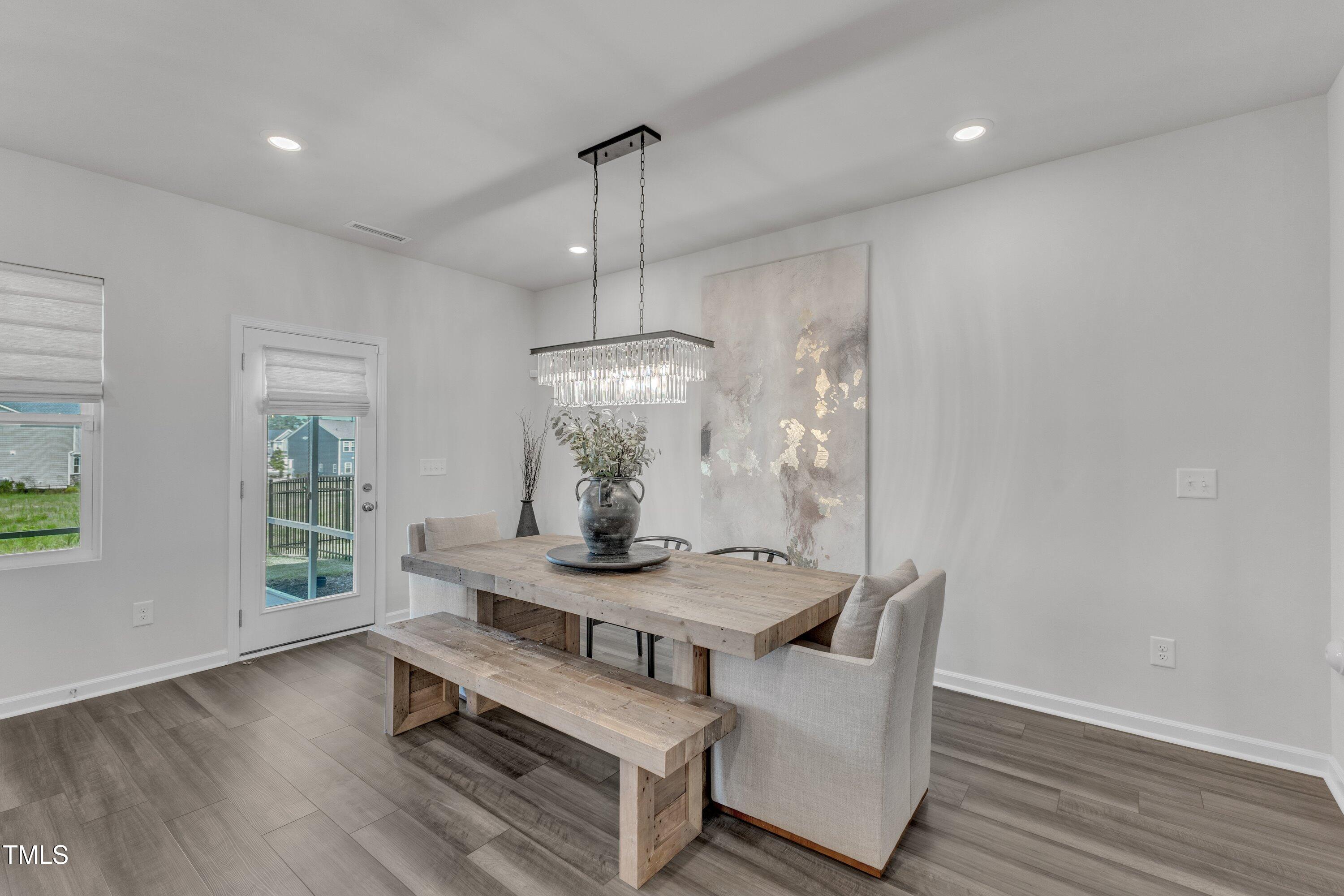 5814 Empathy Lane Raleigh, NC 27616 - Photo 17 of 48 a living room with furniture and a wooden floor