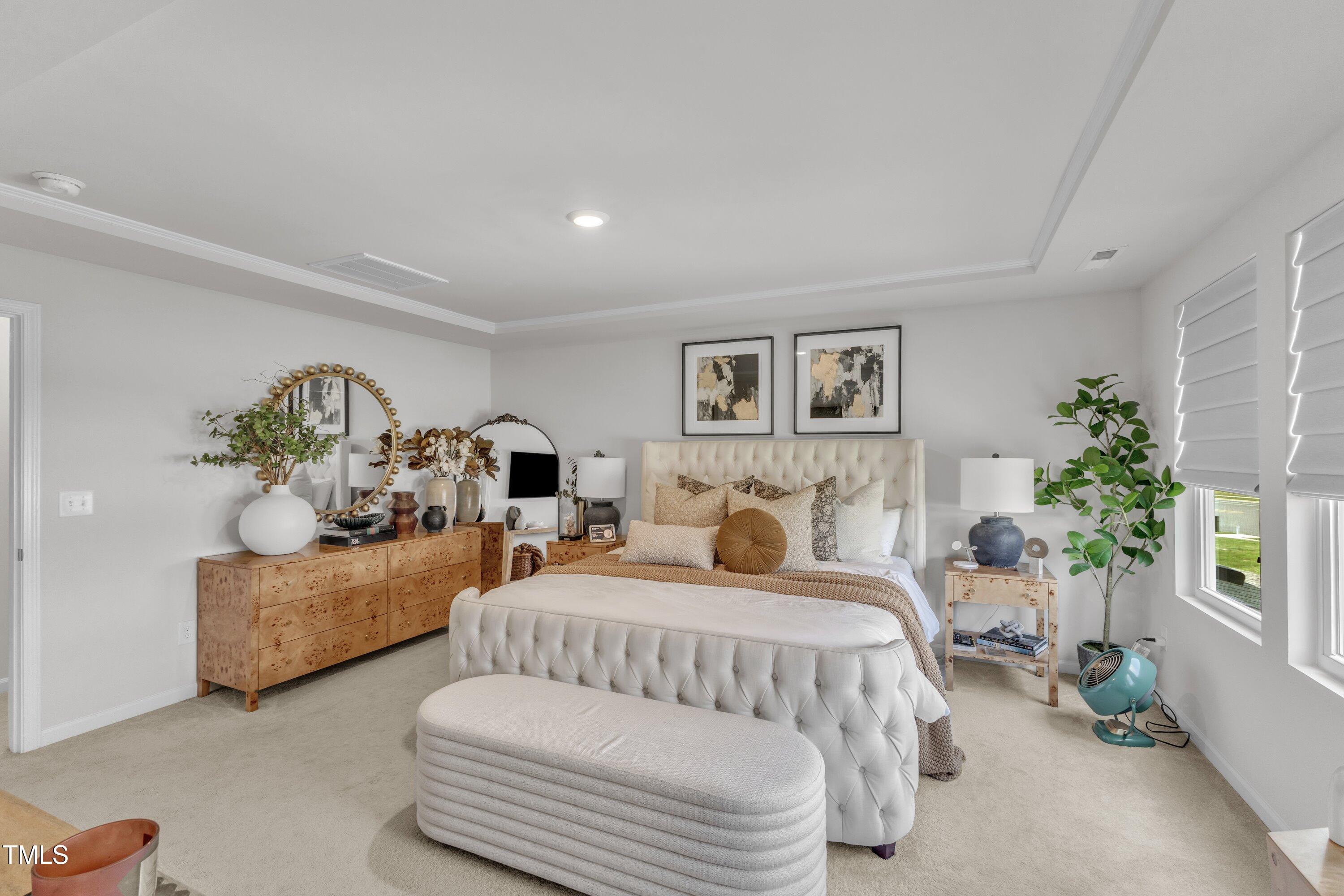 5814 Empathy Lane Raleigh, NC 27616 - Photo 25 of 48 a bedroom with furniture and a couch