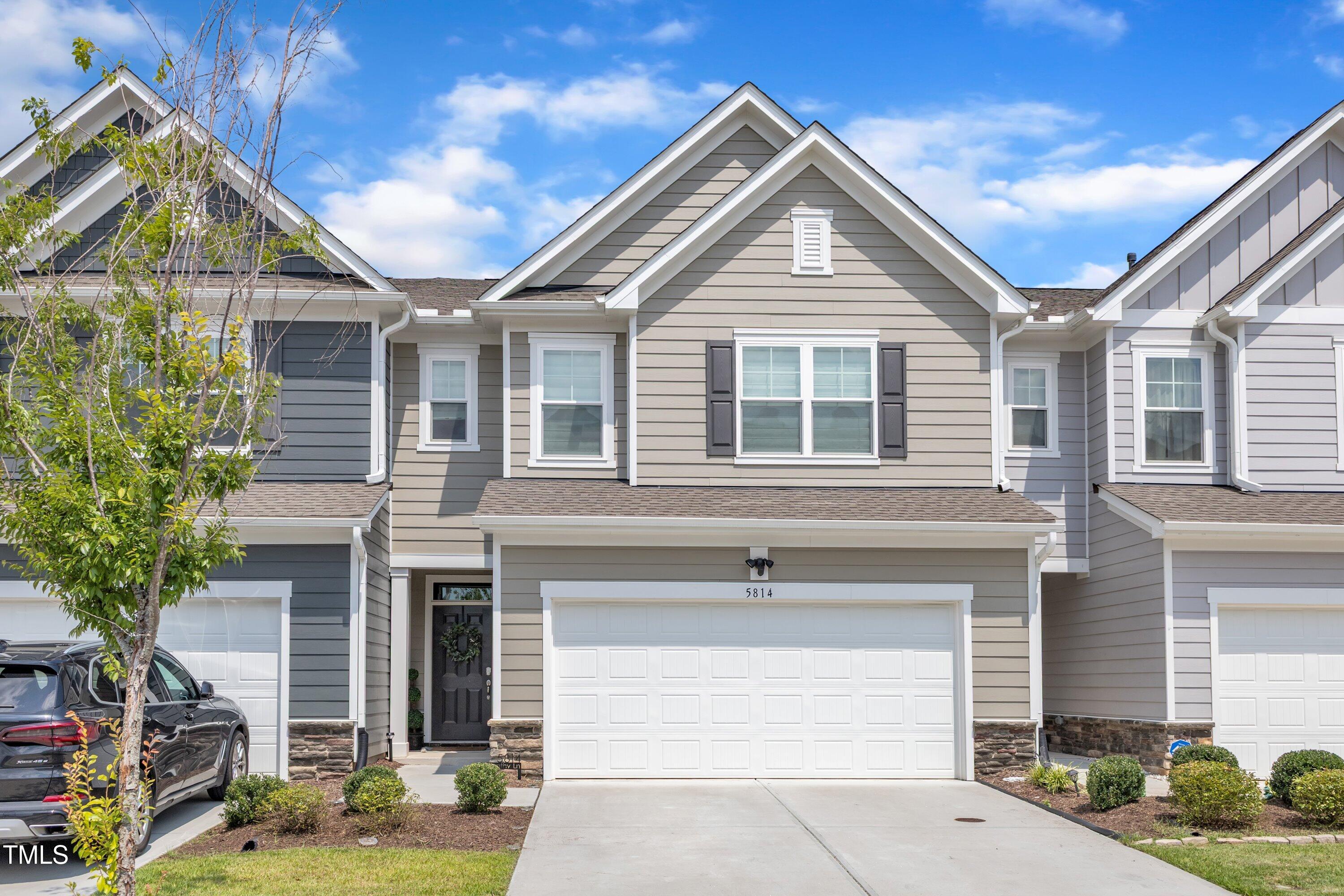 5814 Empathy Lane Raleigh, NC 27616 - Photo 2 of 48 a front view of a house with garden