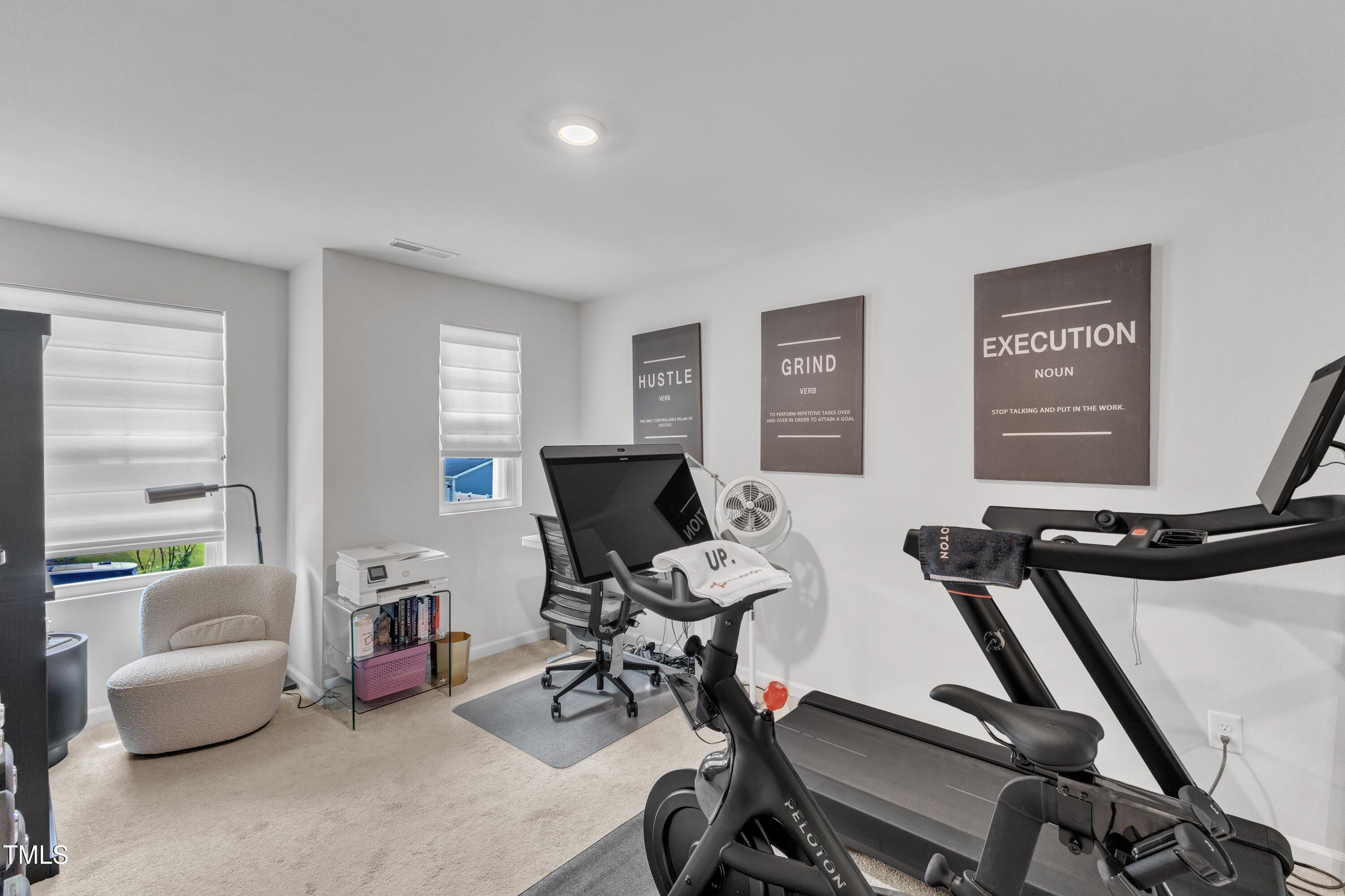 5814 Empathy Lane Raleigh, NC 27616 - Photo 32 of 48 a view of a workspace with furniture and a window