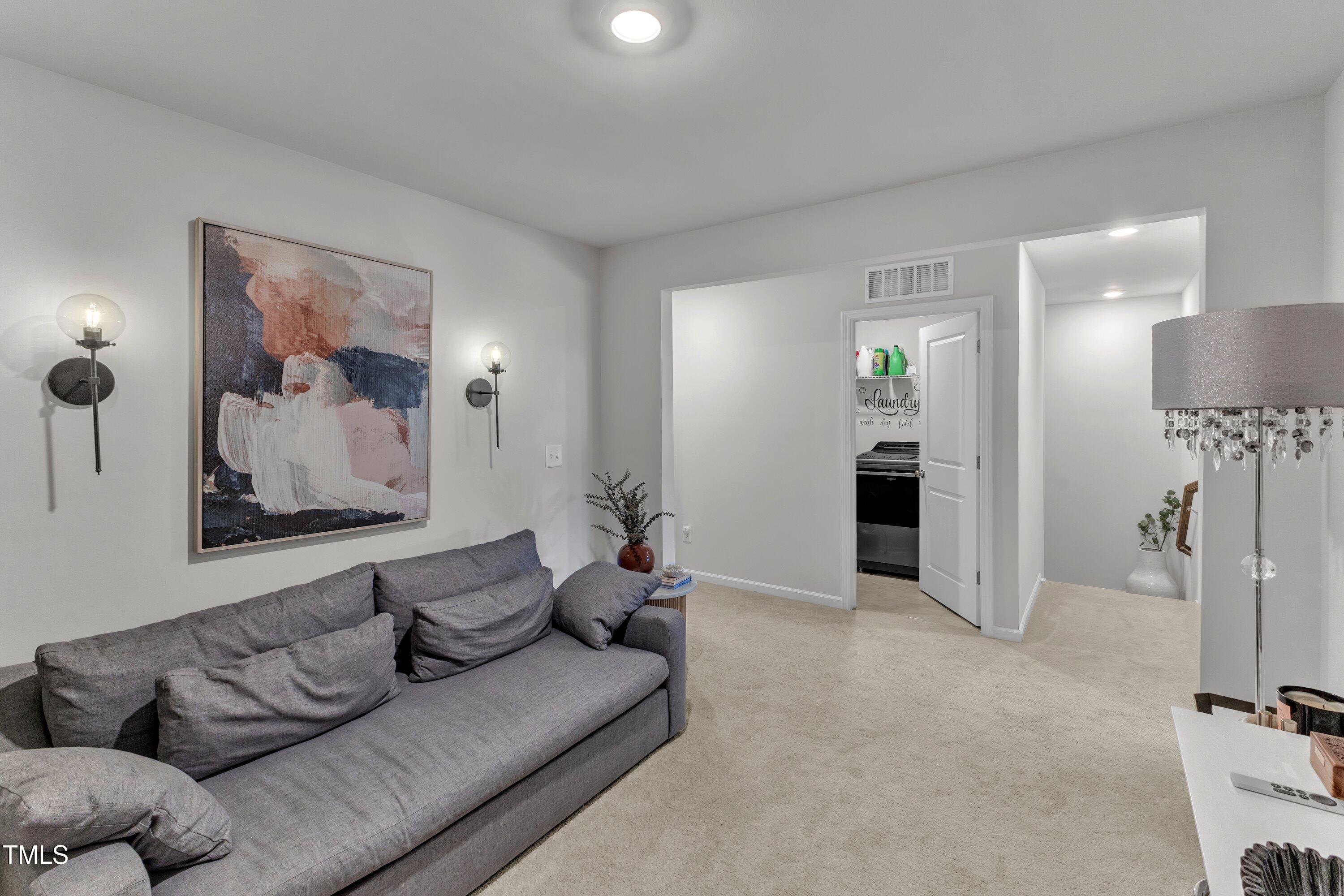 5814 Empathy Lane Raleigh, NC 27616 - Photo 35 of 48 a living room with furniture and a couch