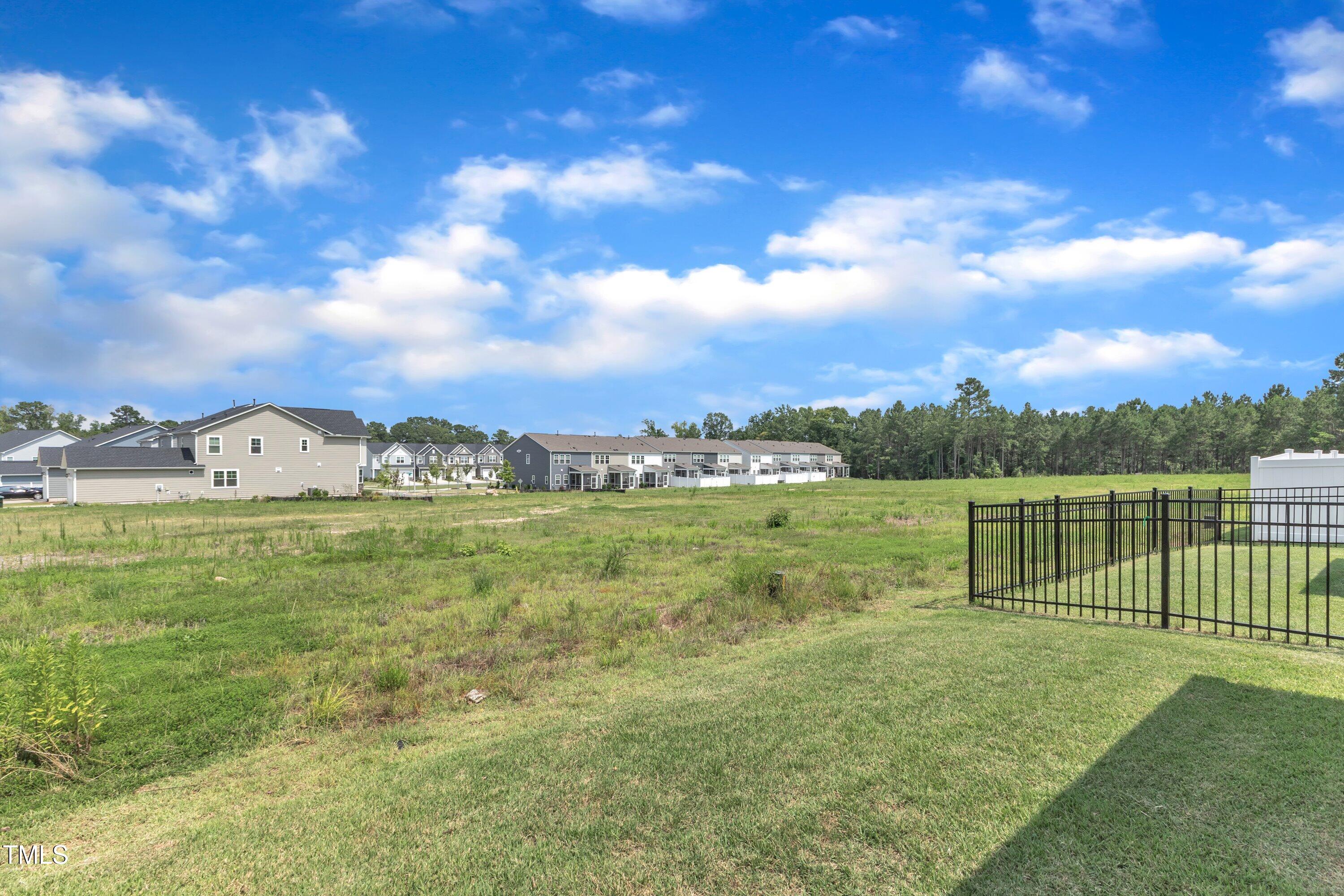 5814 Empathy Lane Raleigh, NC 27616 - Photo 42 of 48 a view of a lake with houses in the back