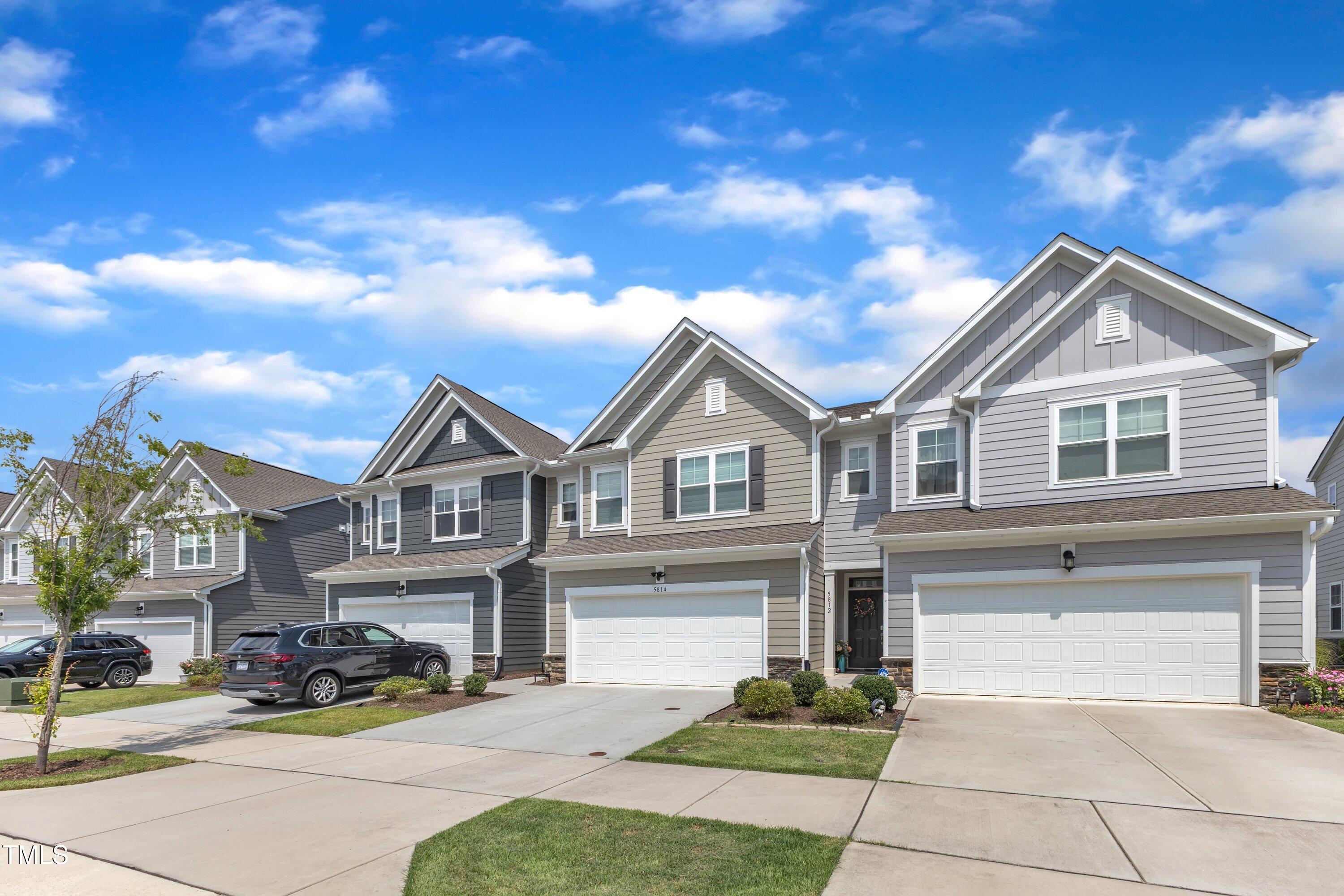5814 Empathy Lane Raleigh, NC 27616 - Photo 5 of 48 a front view of a house with a garden and patio