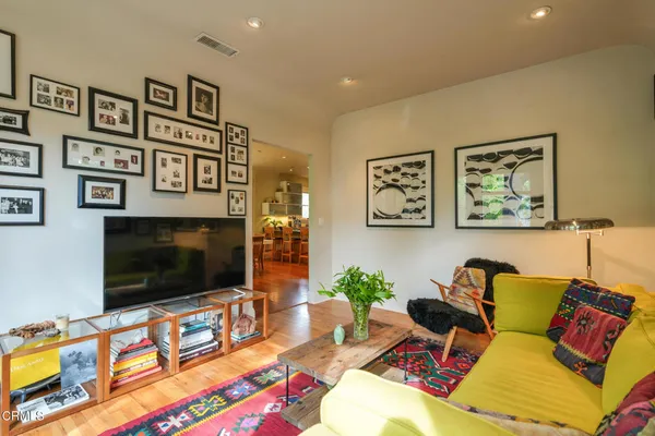 a living room with furniture and a gate