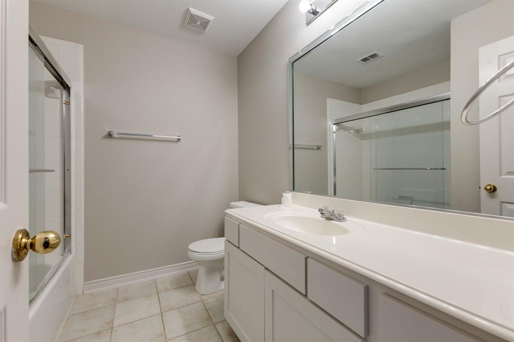 3008 Chippenham Drive Plano, TX 75093 - Photo 23 of 25 a bathroom with a sink toilet and shower