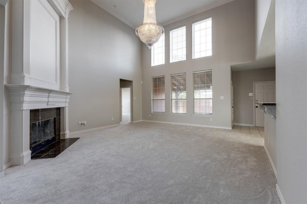 3008 Chippenham Drive Plano, TX 75093 - Photo 5 of 25 a view of an empty room with a fireplace and a window