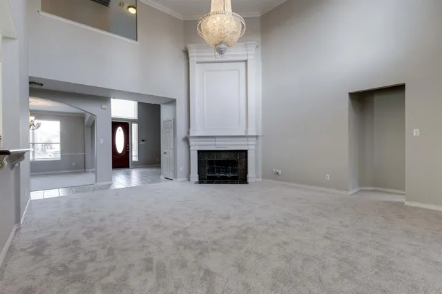 a view of an empty room with a fireplace