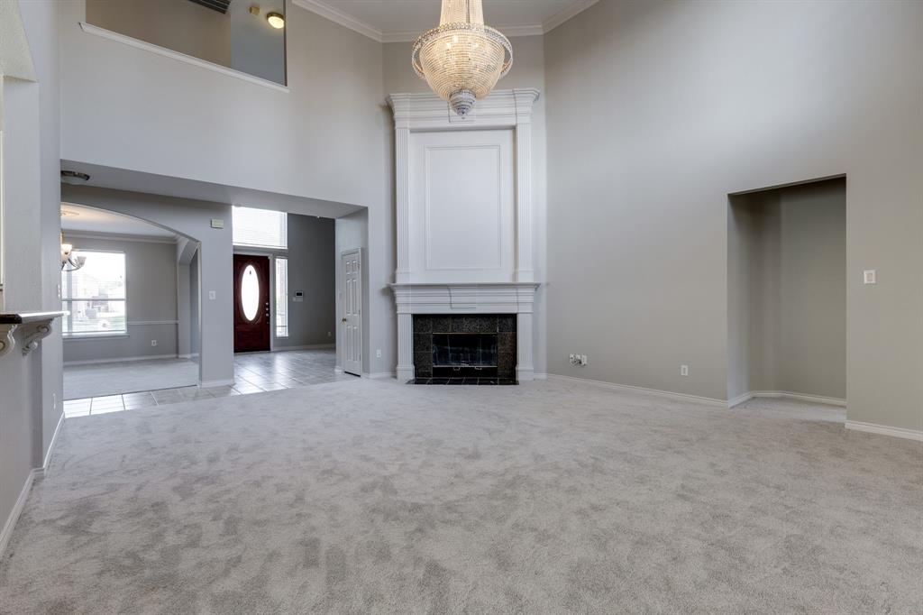 3008 Chippenham Drive Plano, TX 75093 - Photo 7 of 25 a view of an empty room with a fireplace