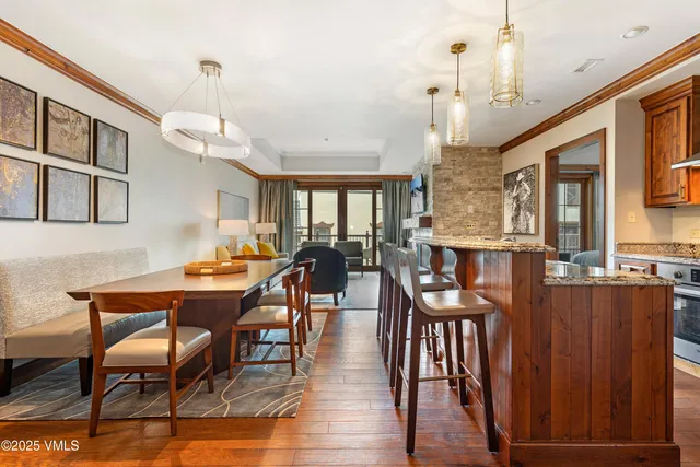a view of a dining room with furniture and wooden floor