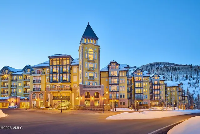 a view of multiple houses with a street