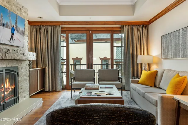 a living room with furniture and a fireplace