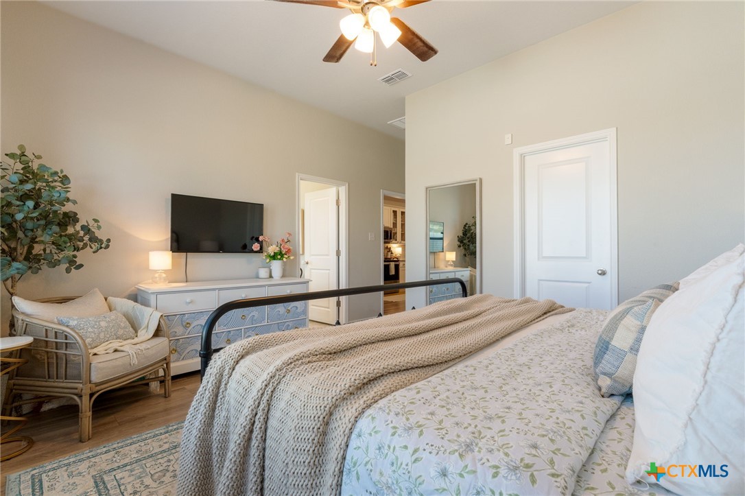 7320 Hammermill Lane Temple, TX 76502 - Photo 16 of 32 a bedroom with bed and a flat screen tv