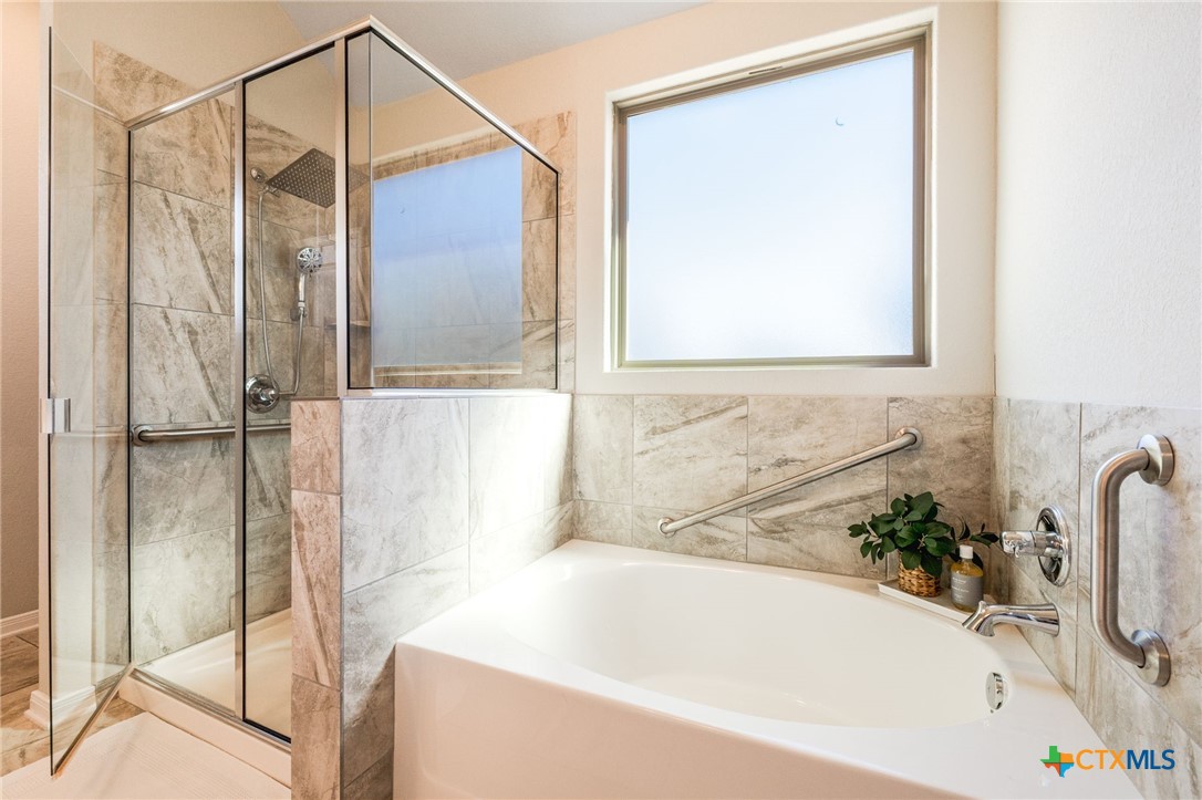 7320 Hammermill Lane Temple, TX 76502 - Photo 20 of 32 a bathroom with a bathtub and a shower