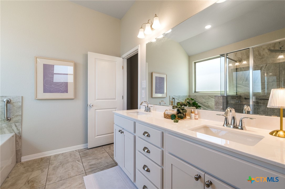 7320 Hammermill Lane Temple, TX 76502 - Photo 21 of 32 a bathroom with a sink vanity and a mirror