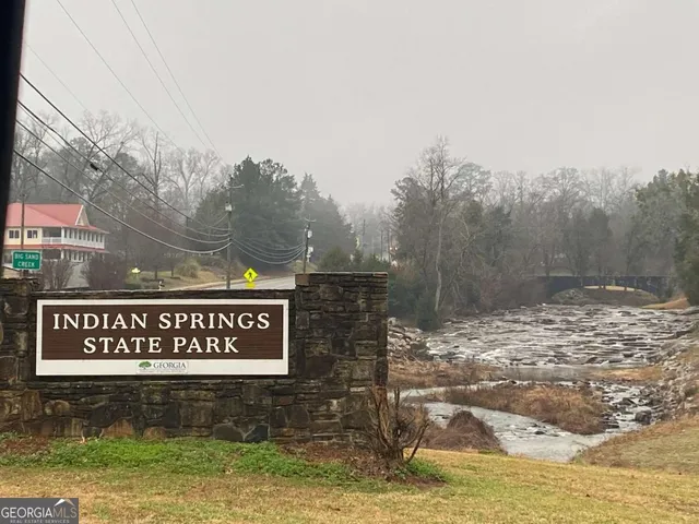 a view of a street with sign board