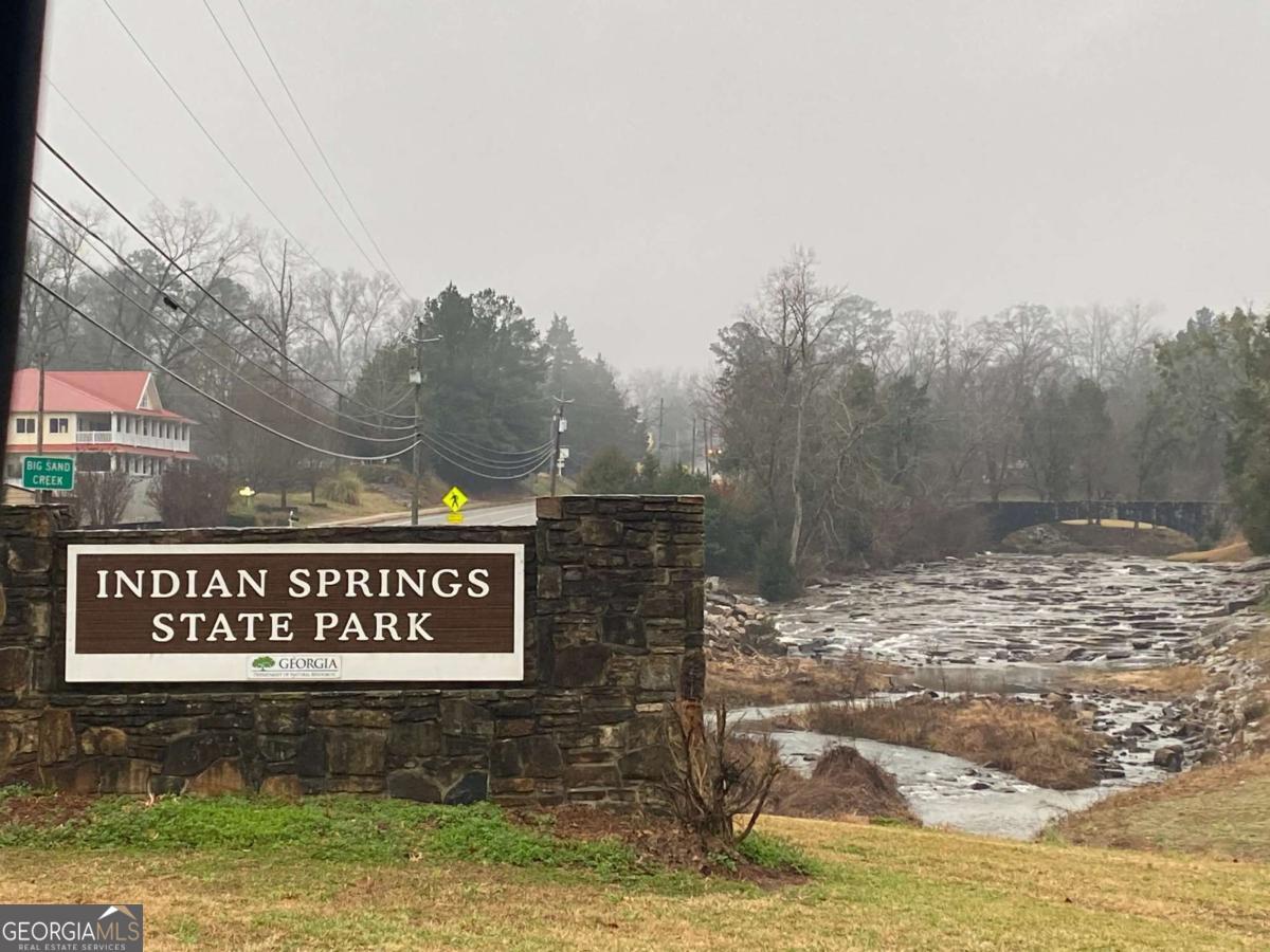 158 Rivers Edge Drive Forsyth, GA 31029 - Photo 10 of 11 a view of a street with sign board