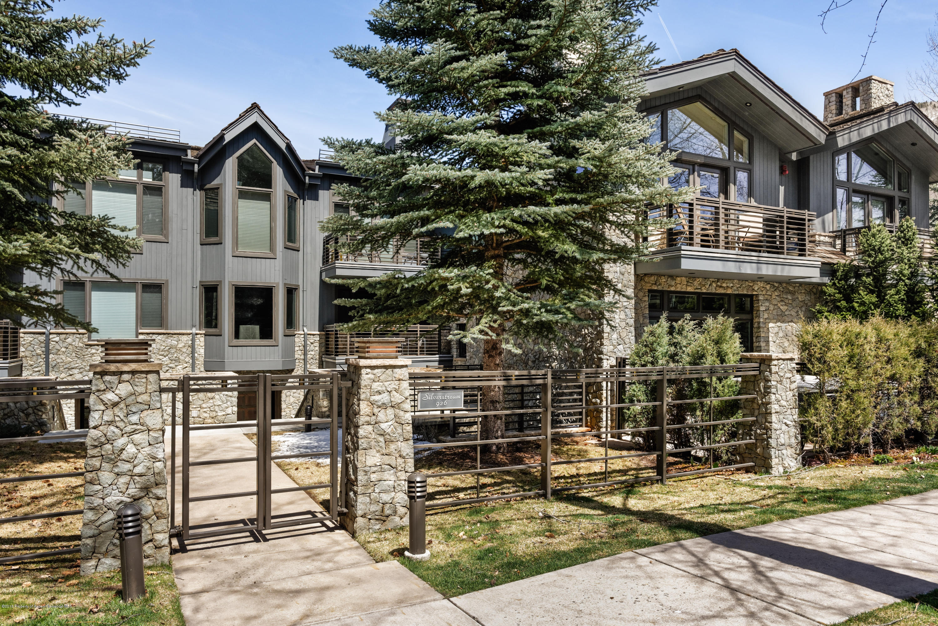 926 East Durant Avenue, Unit 3 Aspen, CO 81611 - Photo 16 of 20 a front view of a house with a garden