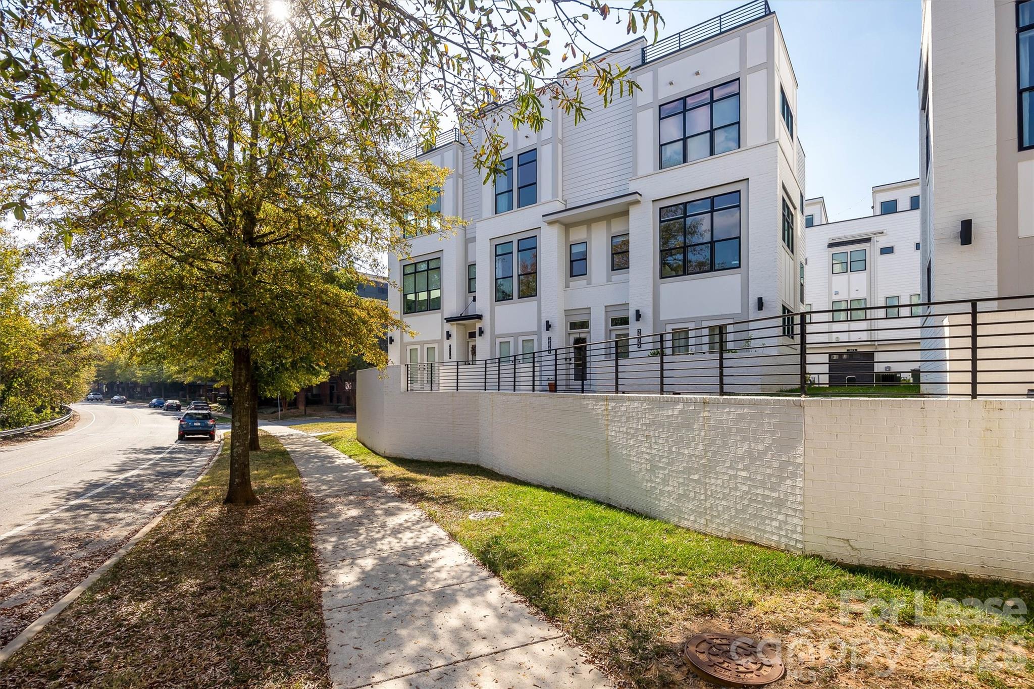 2319 Wesley Village Road Charlotte, NC 28208 - Photo 41 of 44 a view of a building with trees in the background