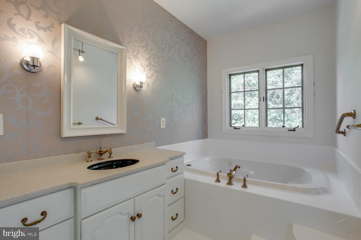 6248 Levi Court Springfield, VA 22150 - Photo 16 of 51 Elegant bathroom with serene ambiance.