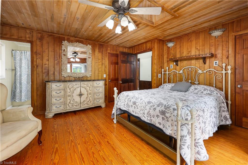 7362 Volunteer Rescue Road Denton, NC 27239 - Photo 27 of 50 Primary bedroom with hardwood floors and a sky light
