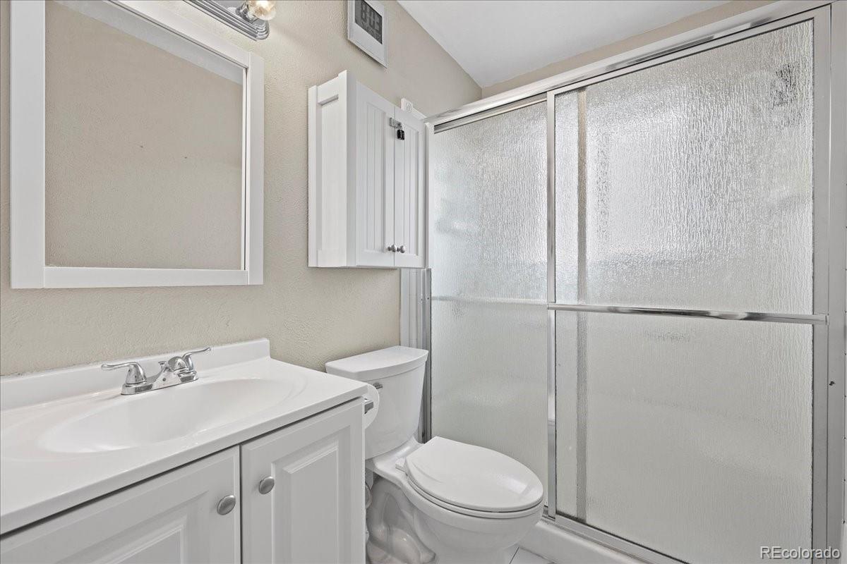 205 Walnut Street Frederick, CO 80530 - Photo 12 of 31 a bathroom with a sink toilet and vanity