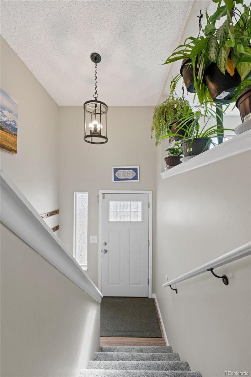 205 Walnut Street Frederick, CO 80530 - Photo 13 of 31 a view of an entryway with wooden floor