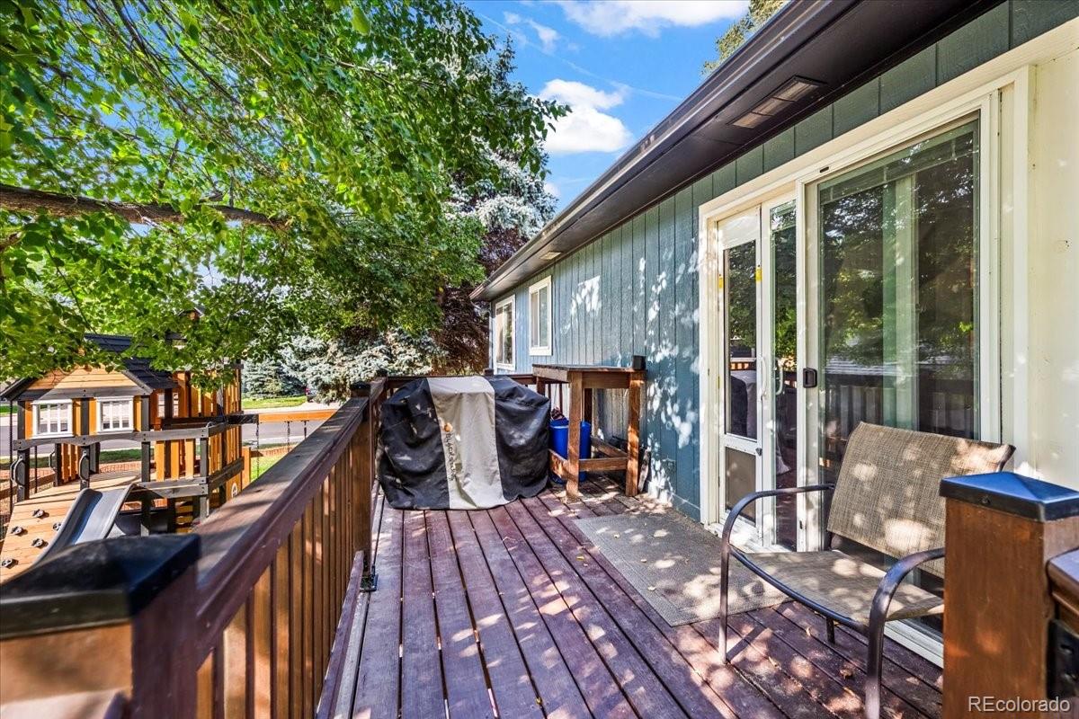 205 Walnut Street Frederick, CO 80530 - Photo 23 of 31 a view of deck with chairs and wooden floor