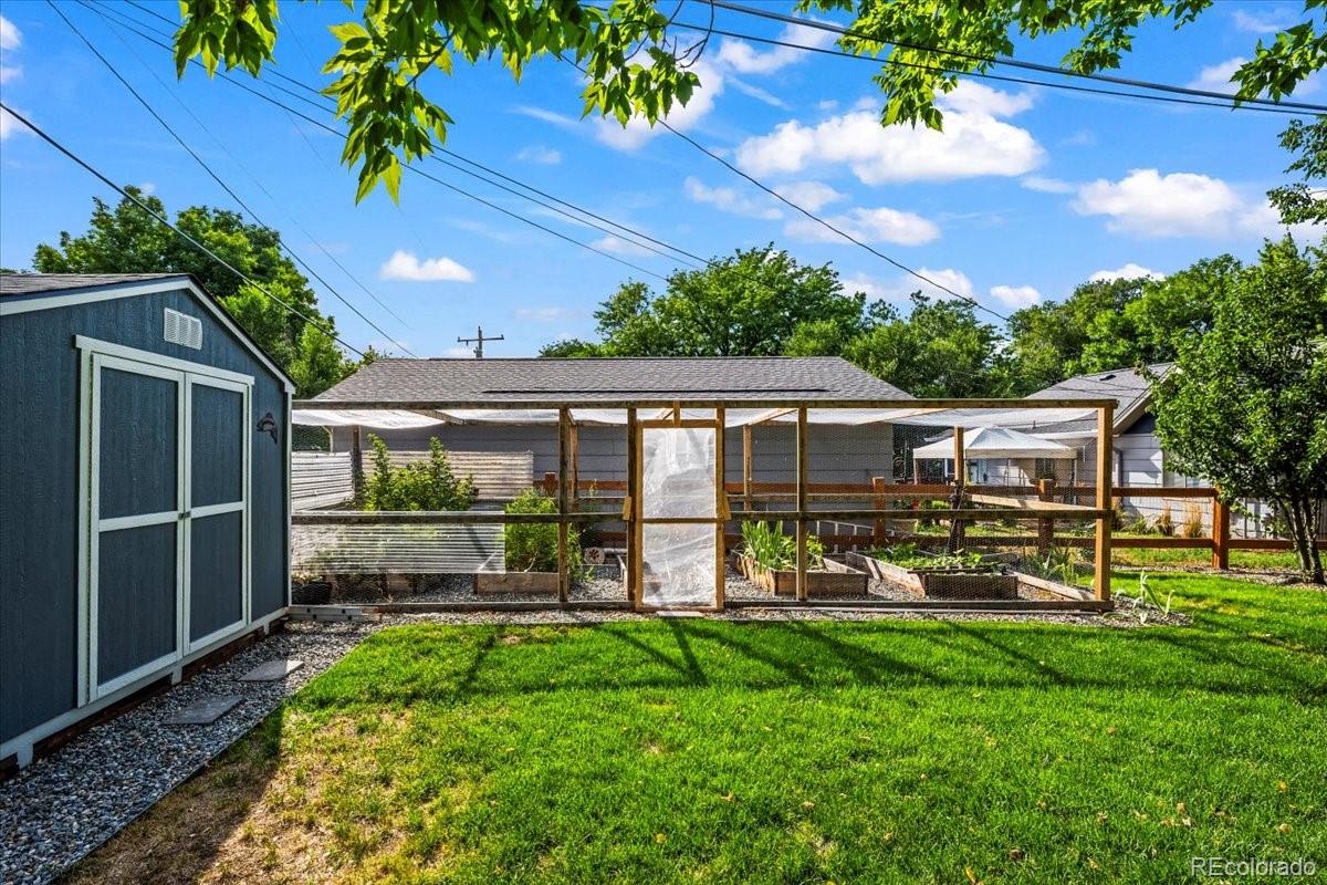205 Walnut Street Frederick, CO 80530 - Photo 26 of 31 a view of a house with backyard porch and sitting area