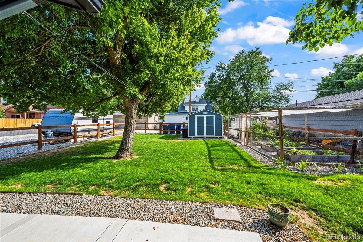 205 Walnut Street Frederick, CO 80530 - Photo 27 of 31 a view of a house with a yard