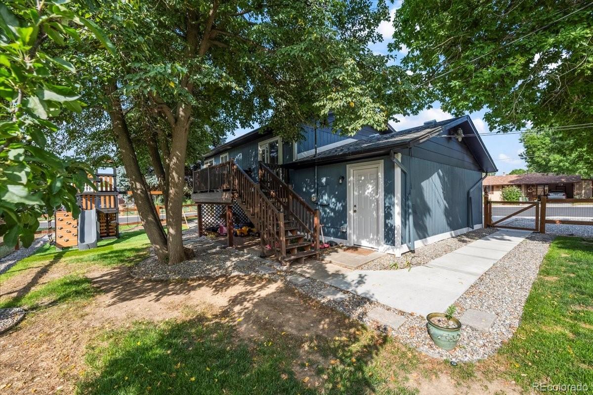 205 Walnut Street Frederick, CO 80530 - Photo 28 of 31 a view of a house with a tree in the forest