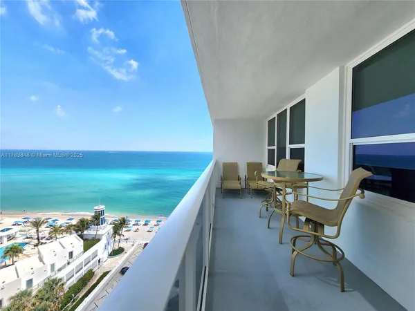 a view of a balcony with chairs
