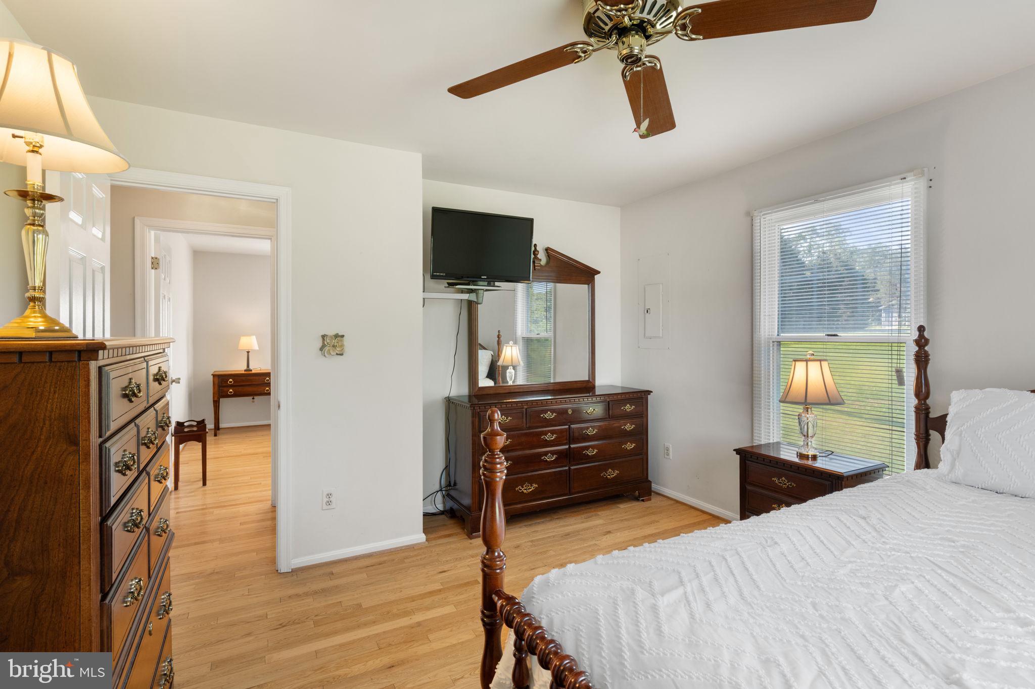 161 Troy Road Louisa, VA 23093 - Photo 27 of 60 a bedroom with a bed and wooden floor