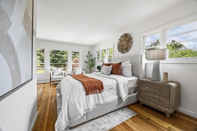 a bedroom with a large bed and a window