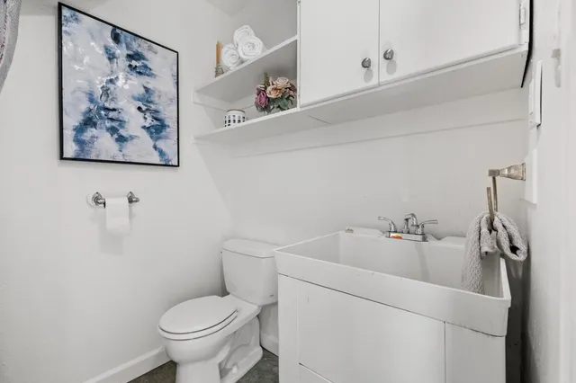 a bathroom with a toilet and a sink