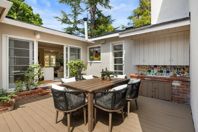a patio with table and chairs