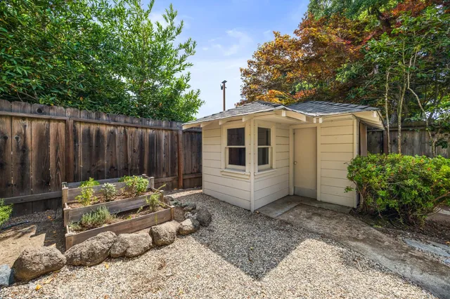 a view of a house with a yard chairs and couches
