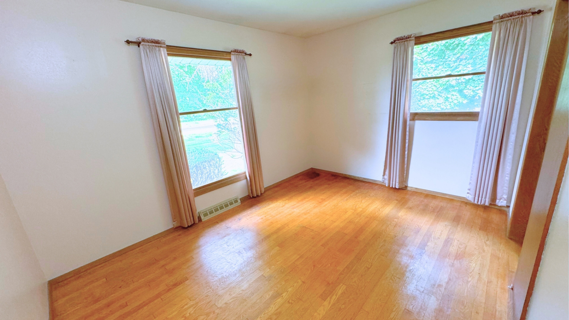 10626 North Grove Road Sycamore, IL 60178 - Photo 17 of 28 a view of empty room with wooden floor and fan