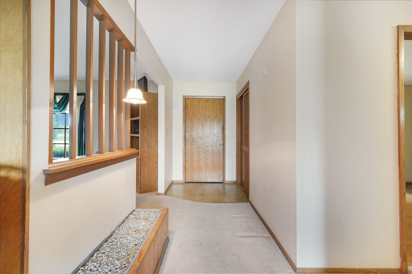 10626 North Grove Road Sycamore, IL 60178 - Photo 2 of 28 a view of a hallway with windows and stairs