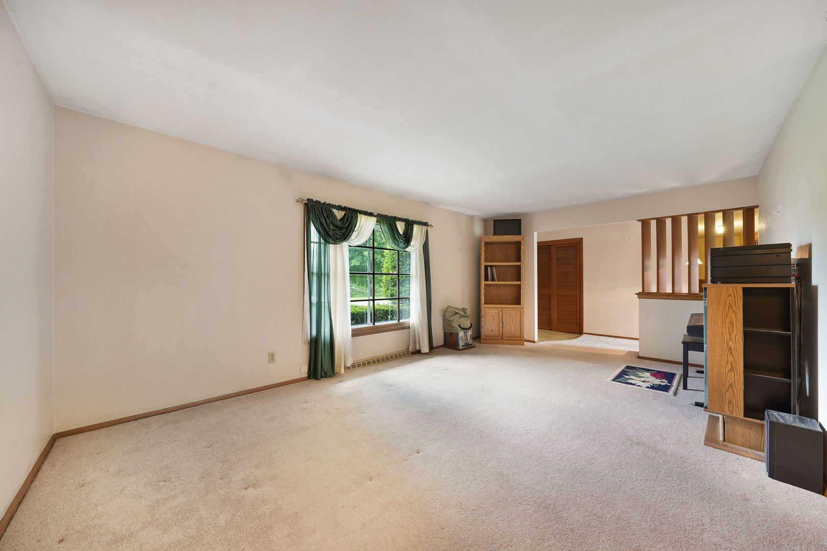 10626 North Grove Road Sycamore, IL 60178 - Photo 5 of 28 an empty room with furniture and a window