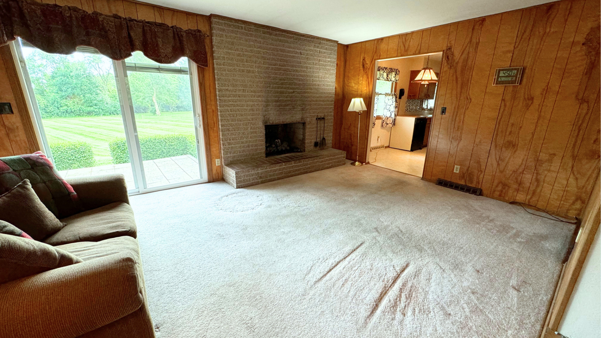 10626 North Grove Road Sycamore, IL 60178 - Photo 7 of 28 a living room with furniture and a fireplace