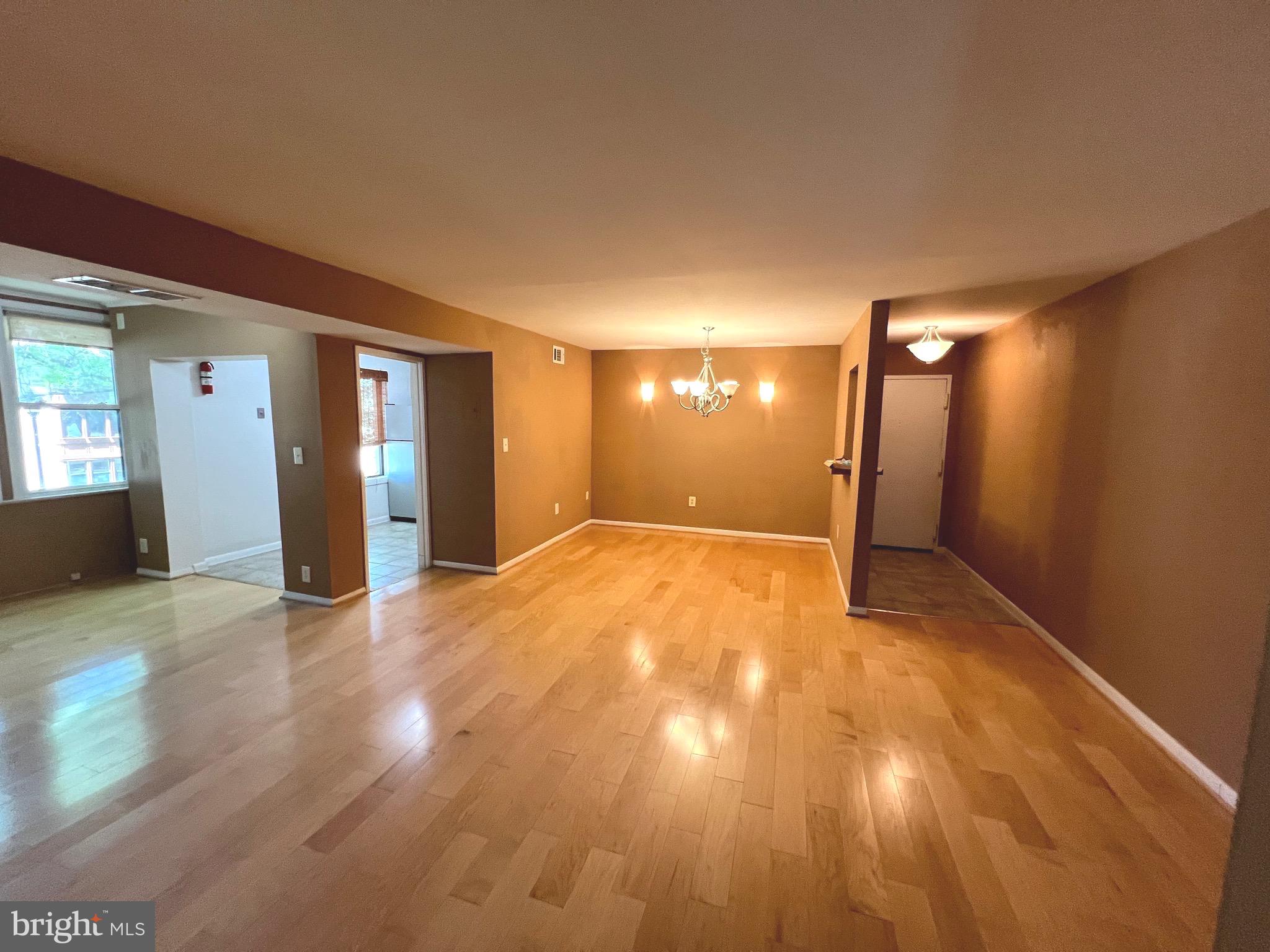 9633 White Acre Road, Unit B2 Columbia, MD 21045 - Photo 20 of 22 a view of empty room with wooden floor
