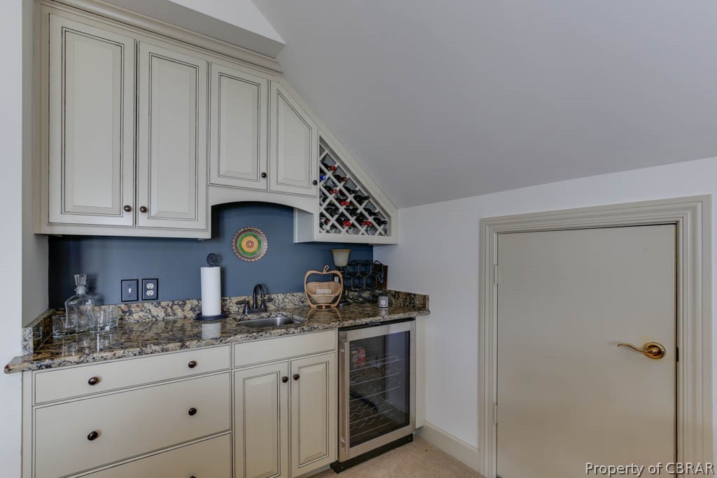3459 Stonewall Road Hayes, VA 23072 - Photo 40 of 50 Wet bar with nice cabinetry, wine cooler, wine storage, granite counter and custom cabinetry.