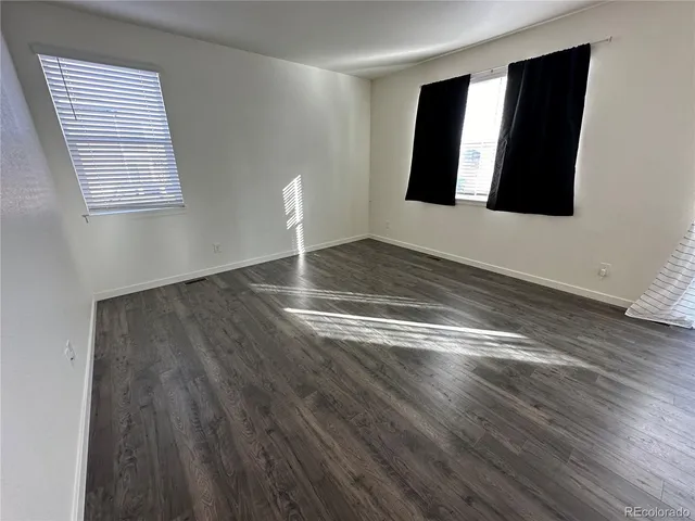 a view of a livingroom with wooden floor