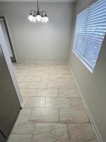 a view of empty room with windows