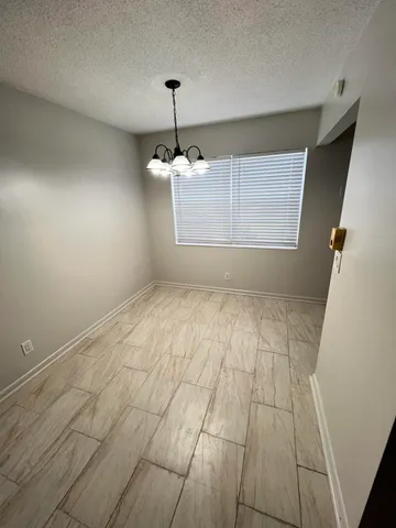 a view of hallway with wooden floor
