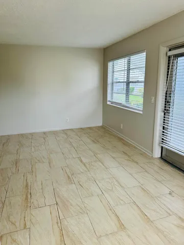 a view of bathroom with a toilet sink and mirror