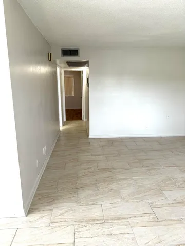 a bathroom with a sink a toilet a mirror and vanity
