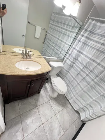 a bathroom with a sink and a shower